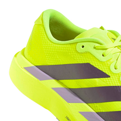 Bright yellow adidas running shoe with black stripes on a white background