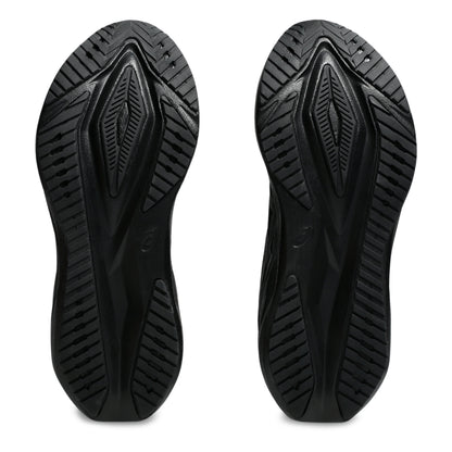 Black running shoe sole with tread pattern on a white background