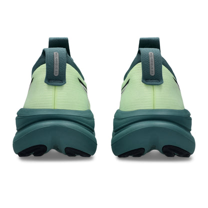 Light green Asics running shoes with a dark green sole on a white background