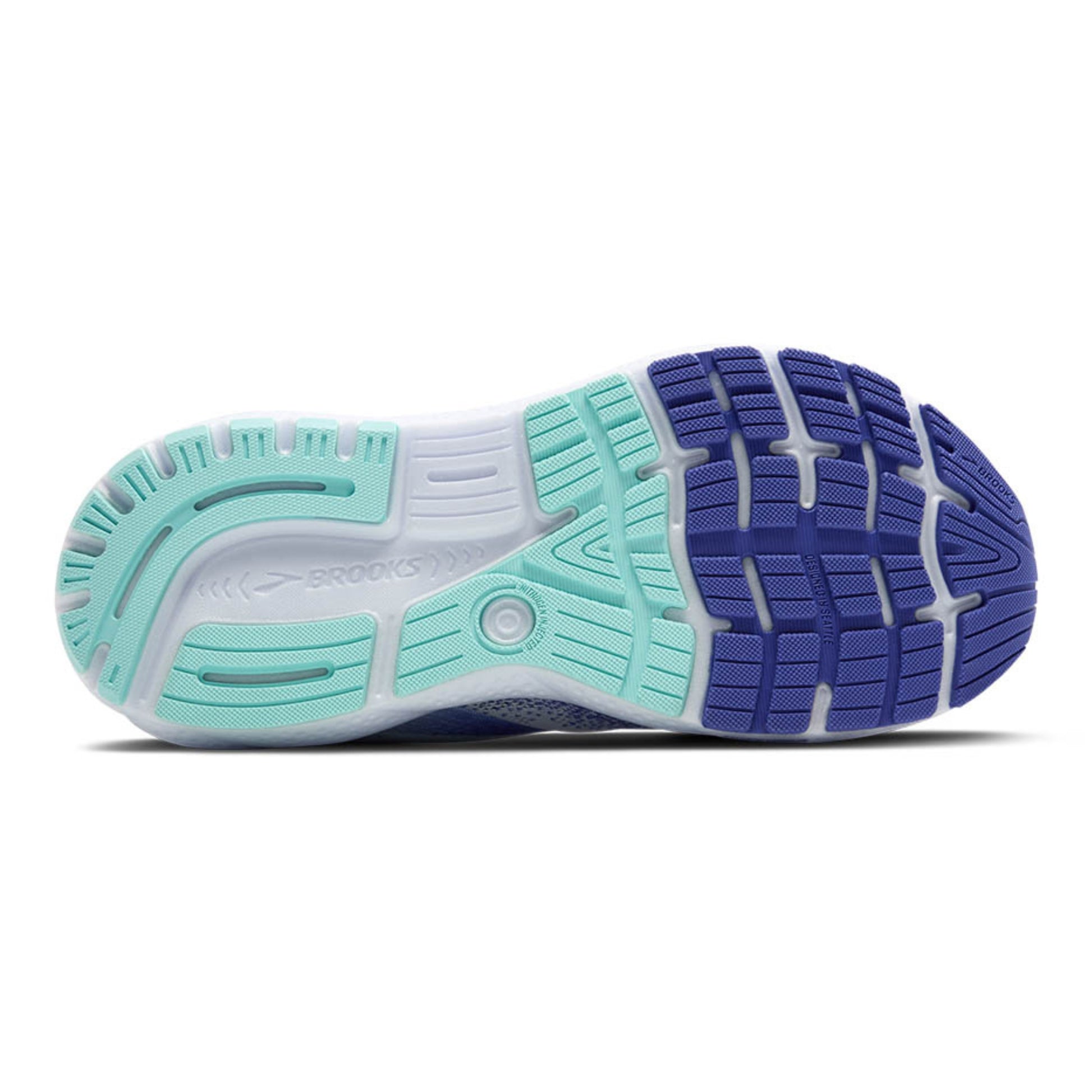 Close-up of a running shoe sole with blue and green design on a white background