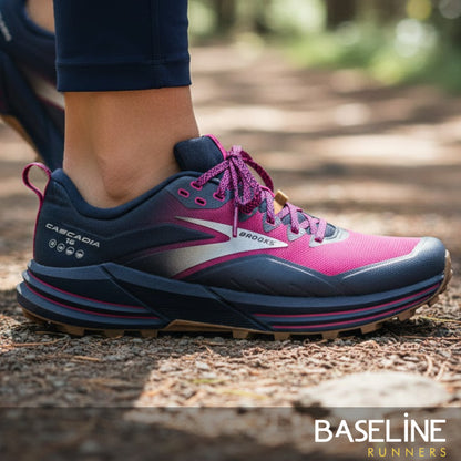 Pink and blue running shoe on a blurred natural background with 'Baseline Runners' branding.