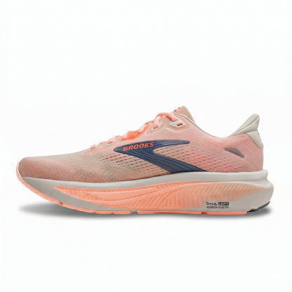 Brooks Ghost running shoe in a light peach-pink and coral colorway with a gray blue Brooks logo on the side, set against a plain white background.