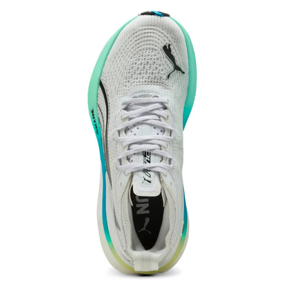 White running shoe with teal accents on a white background