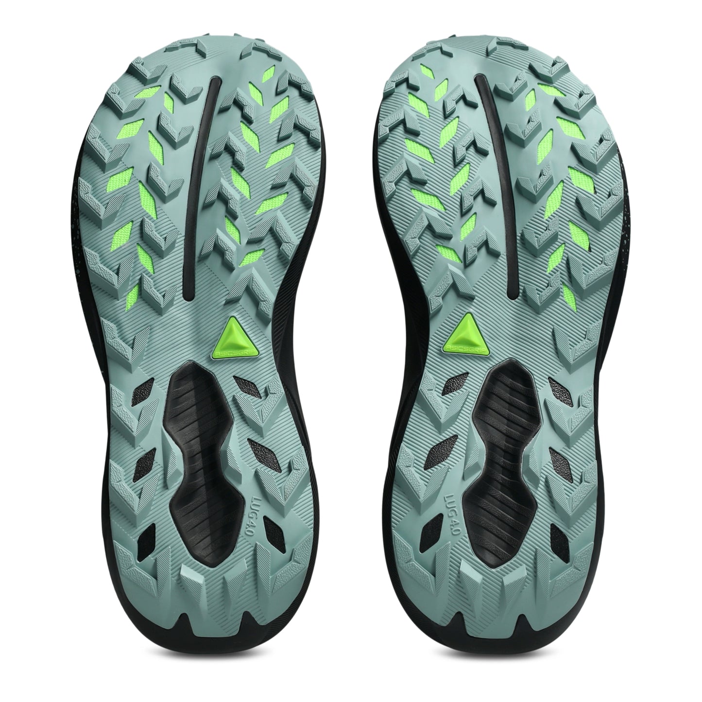 The outsoles of a pair of trail running shoes, featuring a muted teal-green tread pattern with bright neon green accents and a black center channel, shown against a plain white background.