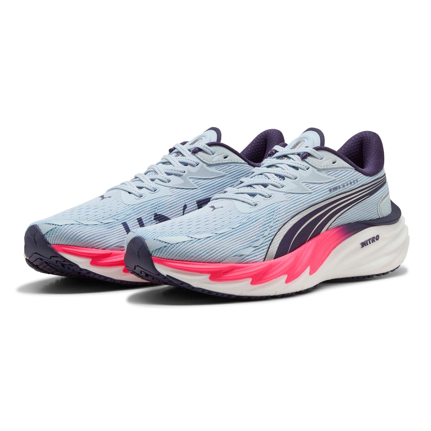 Pair of Puma running shoes with blue, pink, and white design on a white background