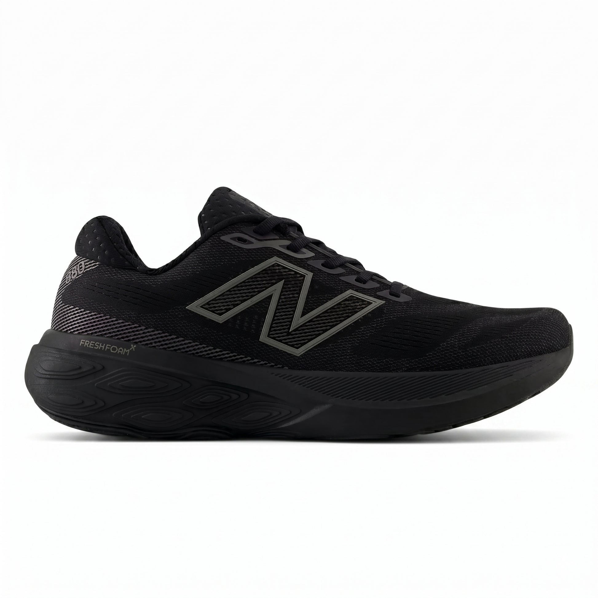 Black New Balance running with unique sole design on a white background