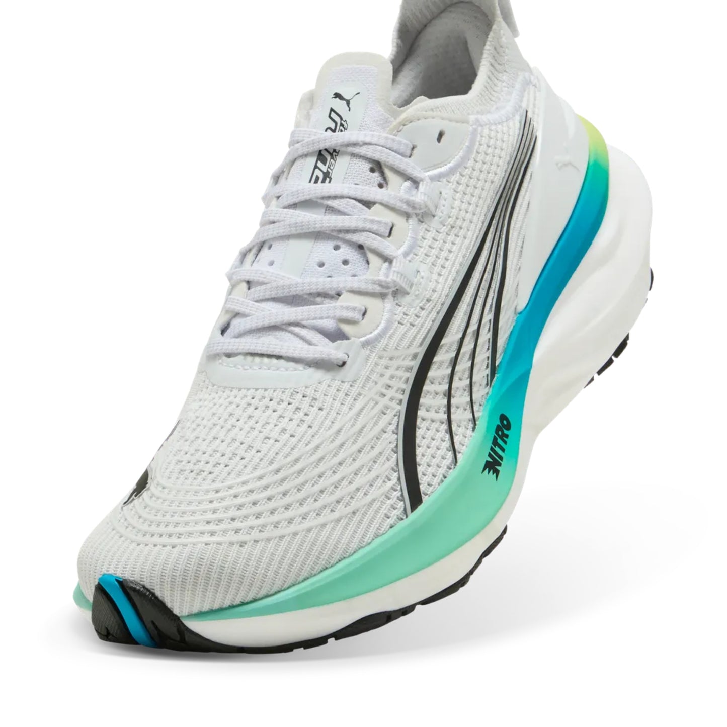 White running shoe with green accents on a white background
