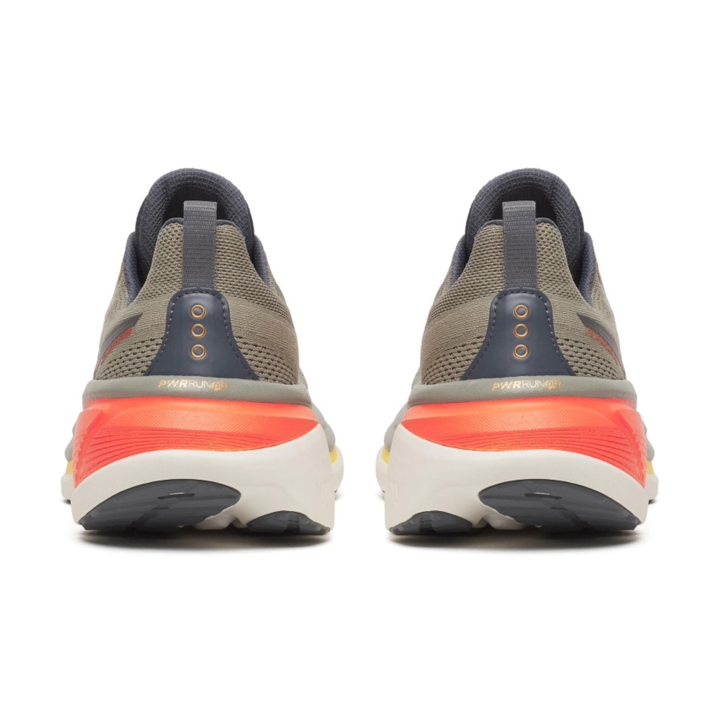 Pair of Saucony running shoes showing sole design on a white background