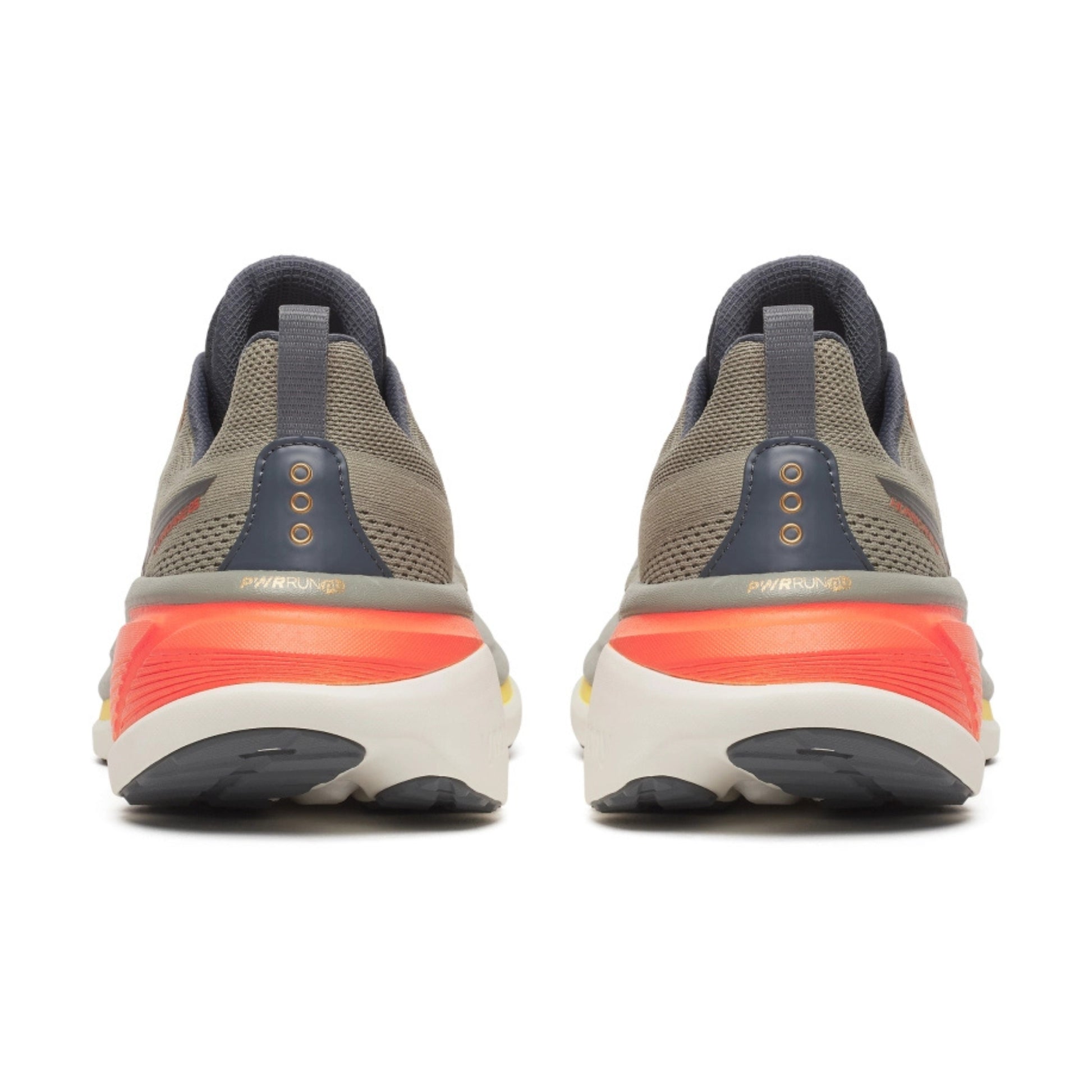 Pair of Saucony running shoes showing sole design on a white background