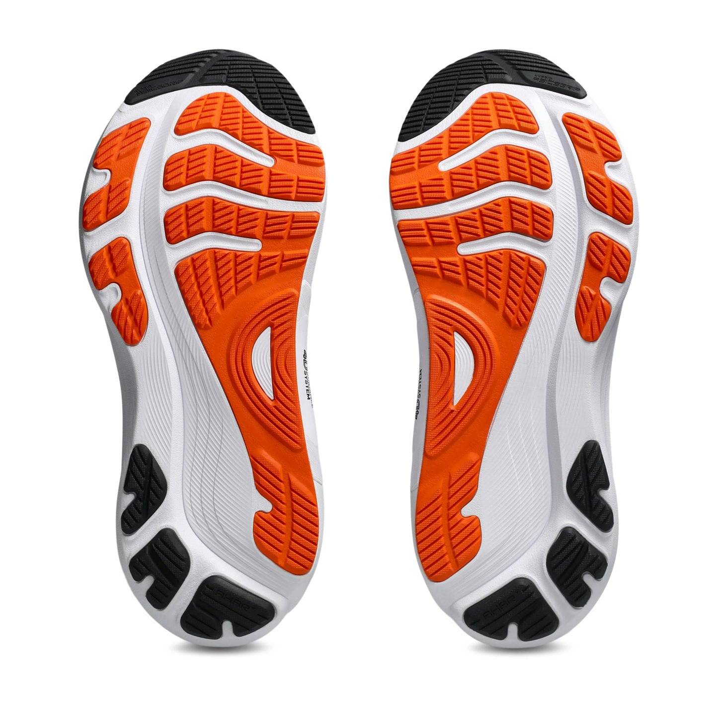 Close-up of a pair of running shoes with orange and black sole design on a white background