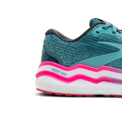 Storm blue running shoe with pink and white sole on a white background