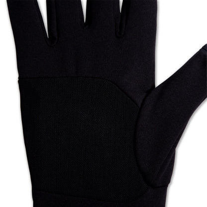 Close up of a black glove on a white background
