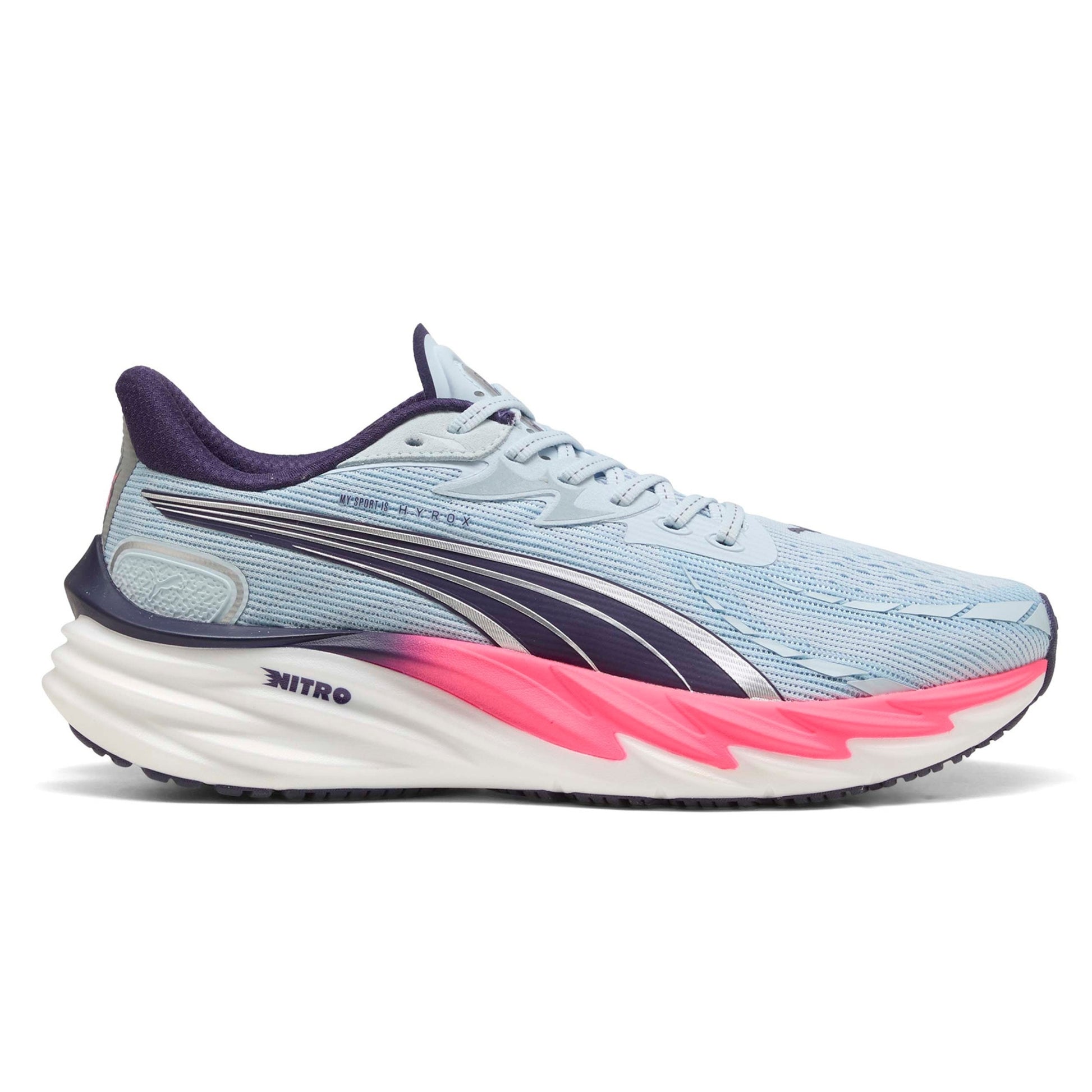 Light blue Puma running shoe with pink sole on a white background