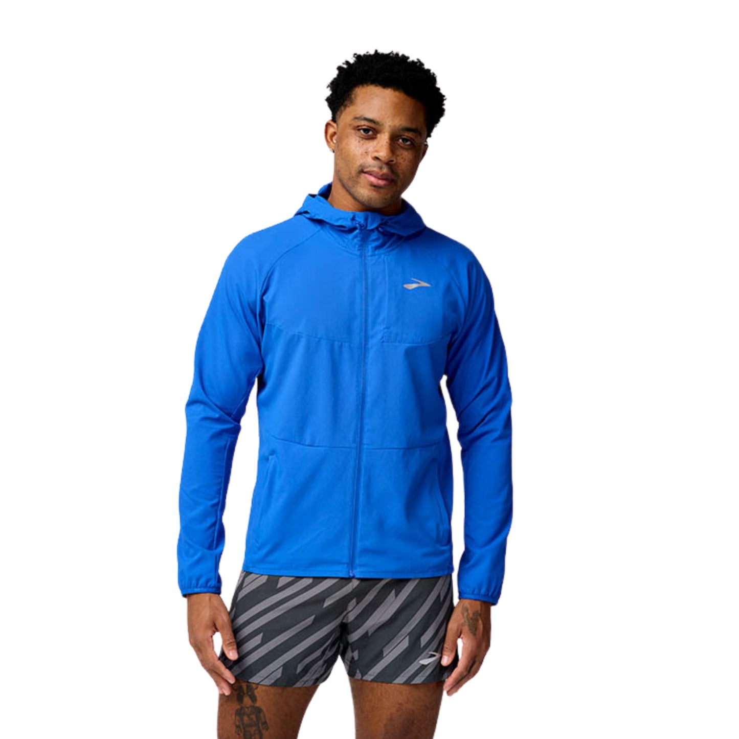 Man wearing a blue Brooks jersey on a white background