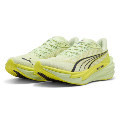 Light green Puma running shoes with yellow soles on a white background