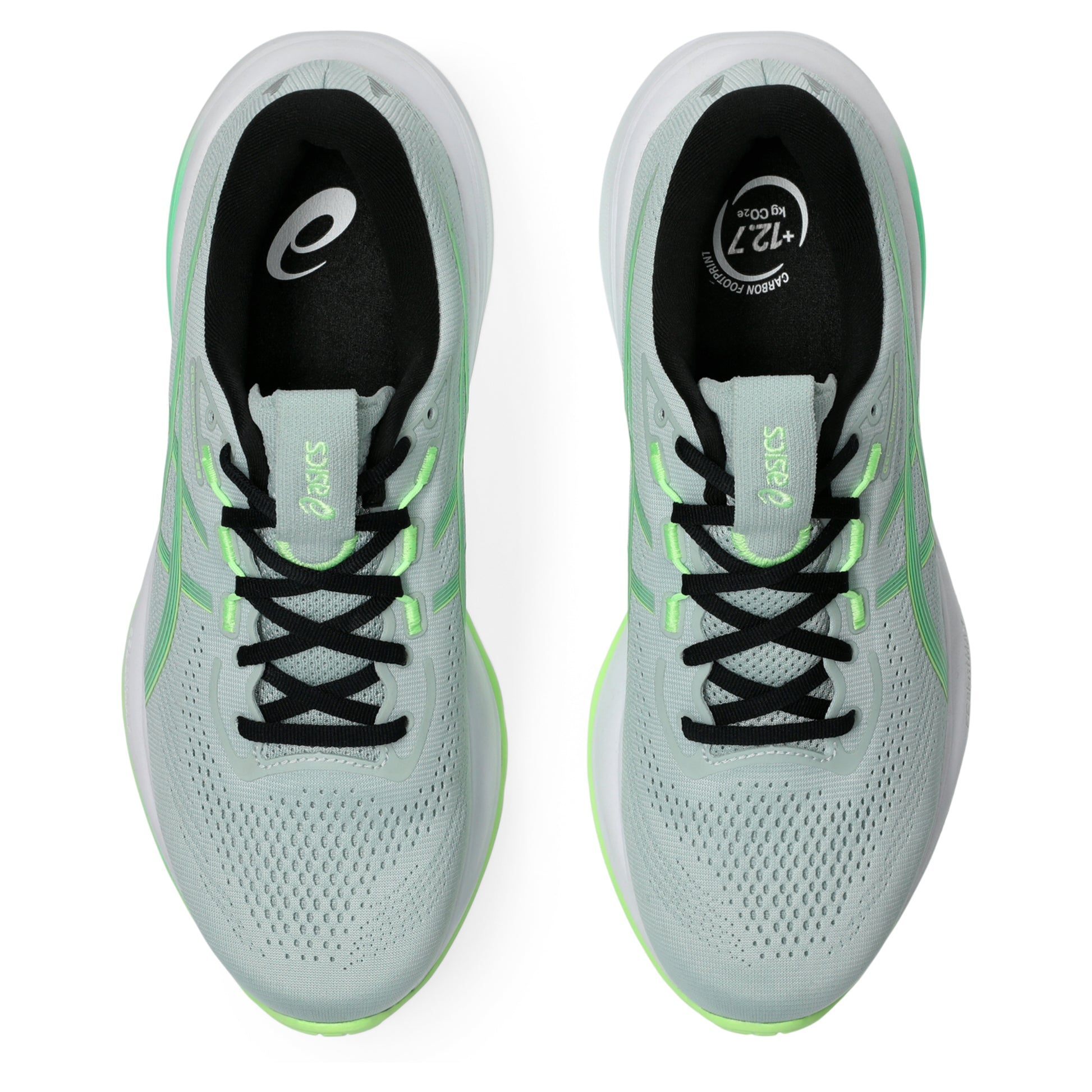 Light blue Asics running shoes with black and green accents on a white background