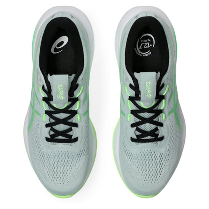 Light blue Asics running shoes with black and green accents on a white background