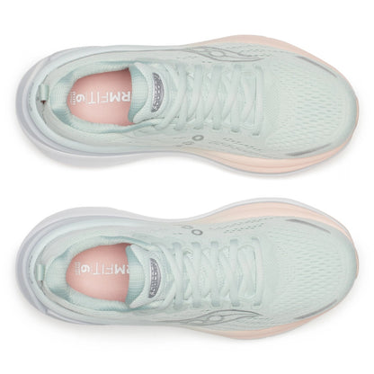 Pair of light green Saucony running shoes with pink soles on a white background