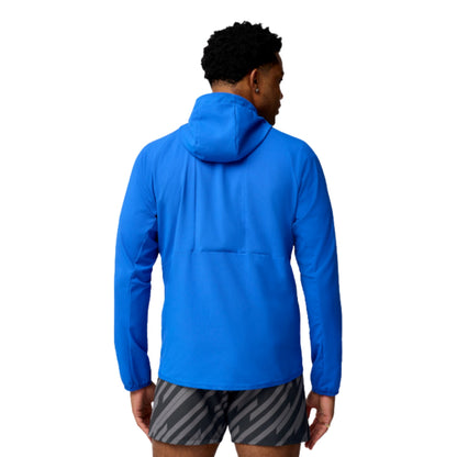 Man wearing a blue Brooks jersey on a white background