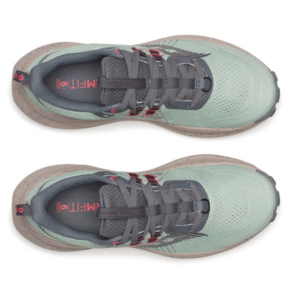 Pair of green running shoes with gray soles on a white background