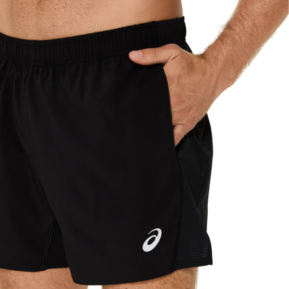 Man wearing running shorts with branding logo