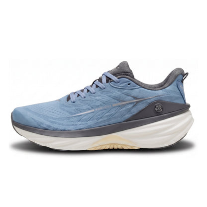 A light blue and gray Puma running shoe with a thick white and beige midsole, shown in a side profile on a white background.