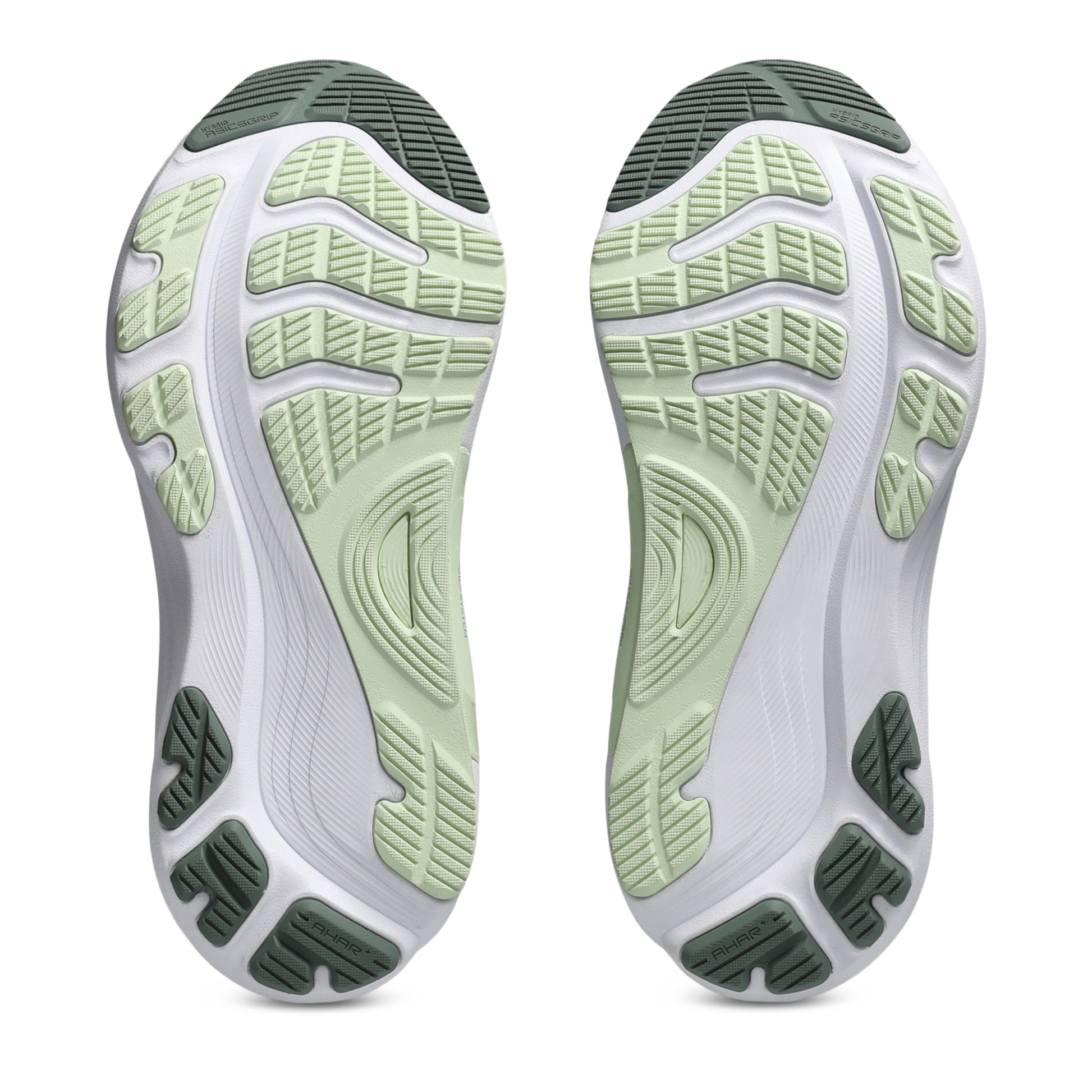 Close-up of a pair of white athletic shoes with green soles on a white background