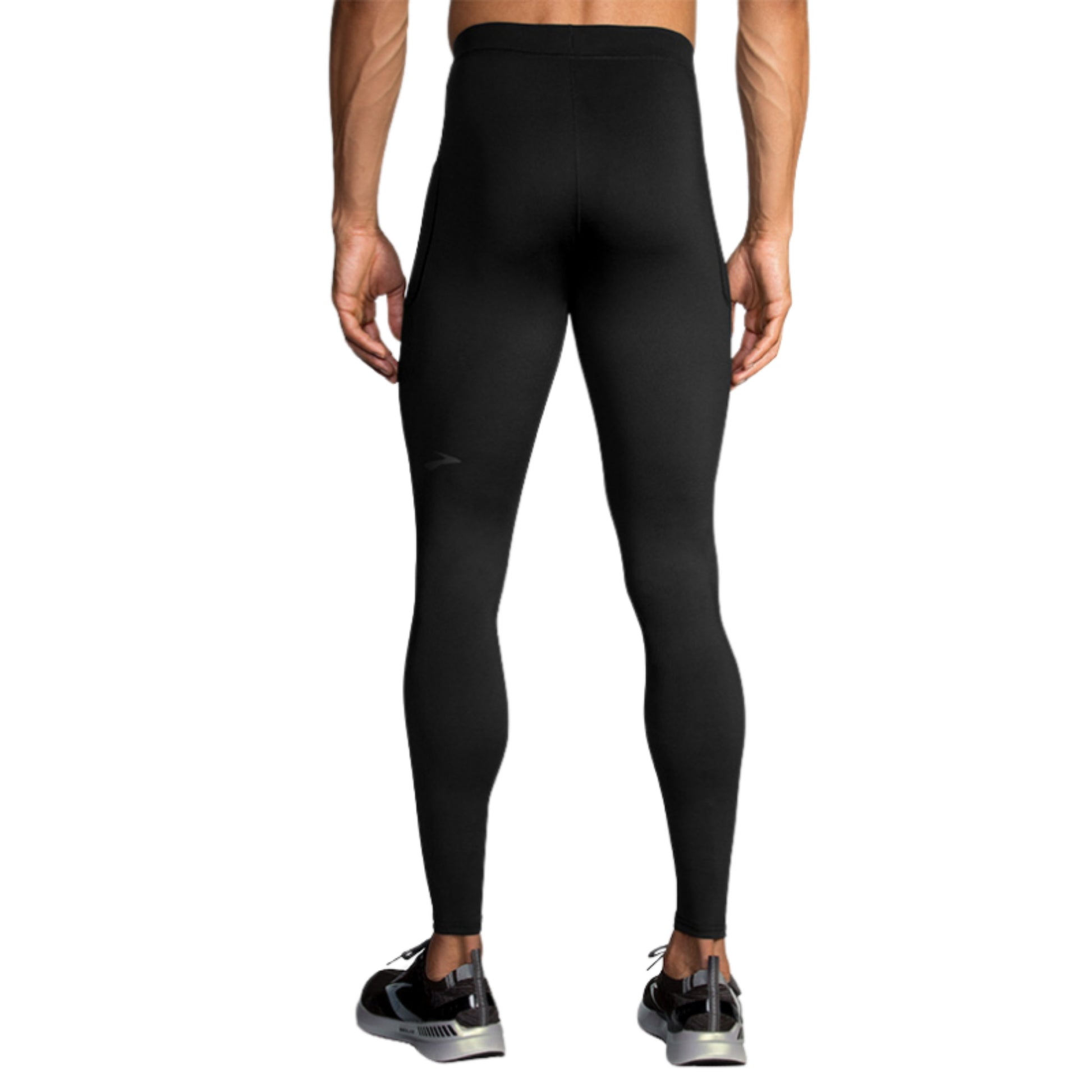 Man wearing a black Brooks tights on a white background