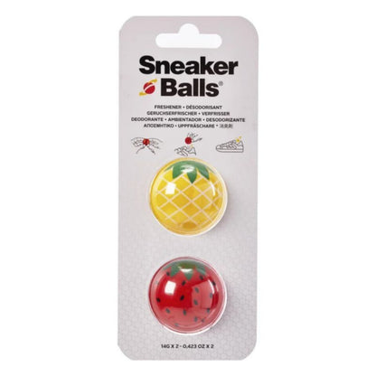 Packaged sneaker balls with pineapple and watermelon designs on a white background
