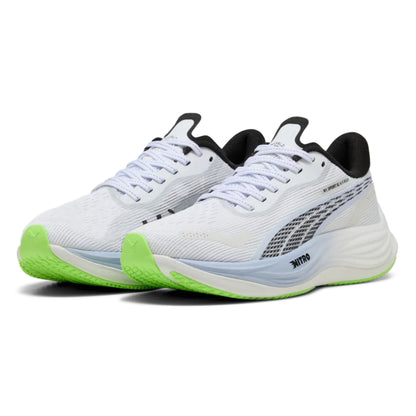 White Puma running shoes with black and green accents on a white background