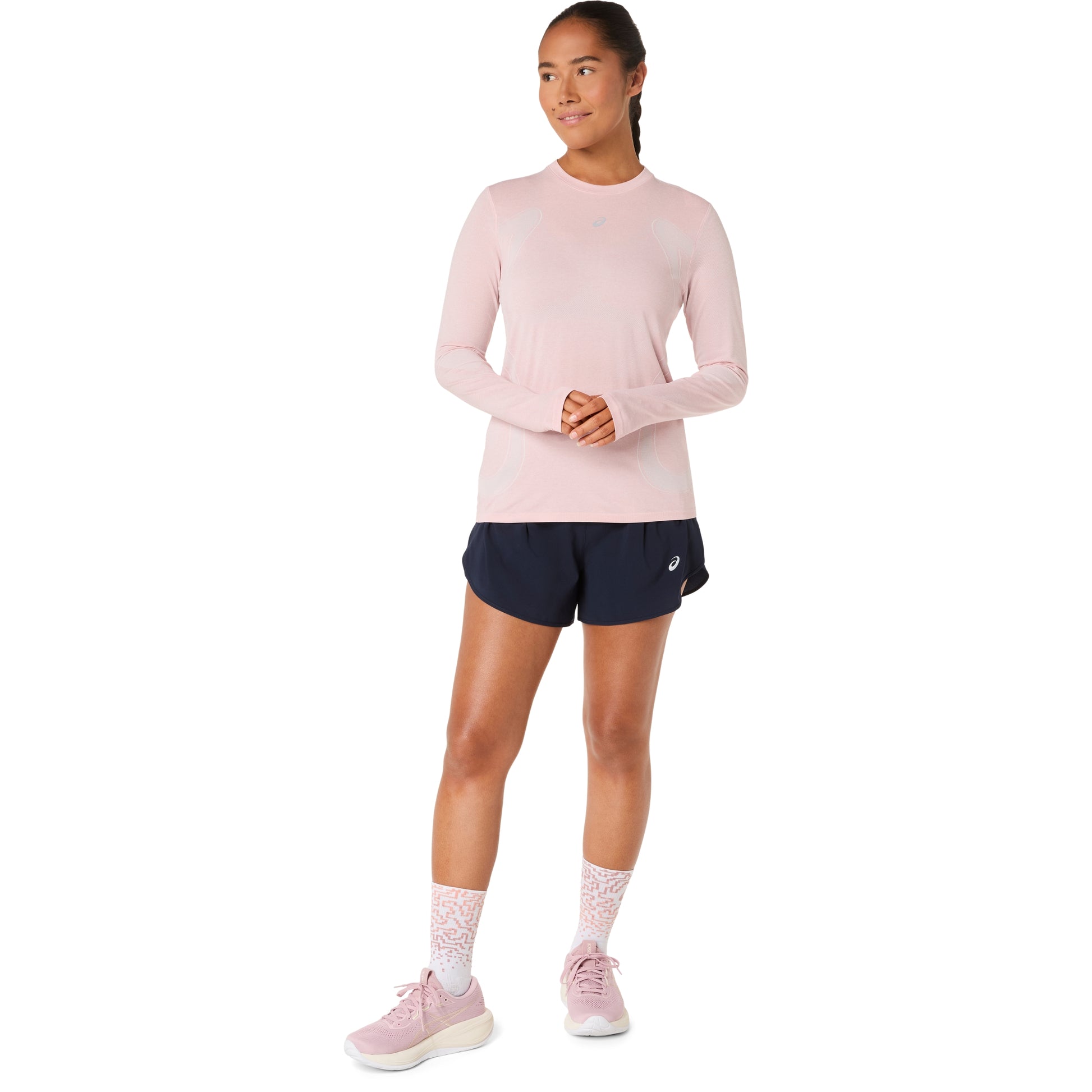 Woman wearing a light pink long-sleeve athletic shirt