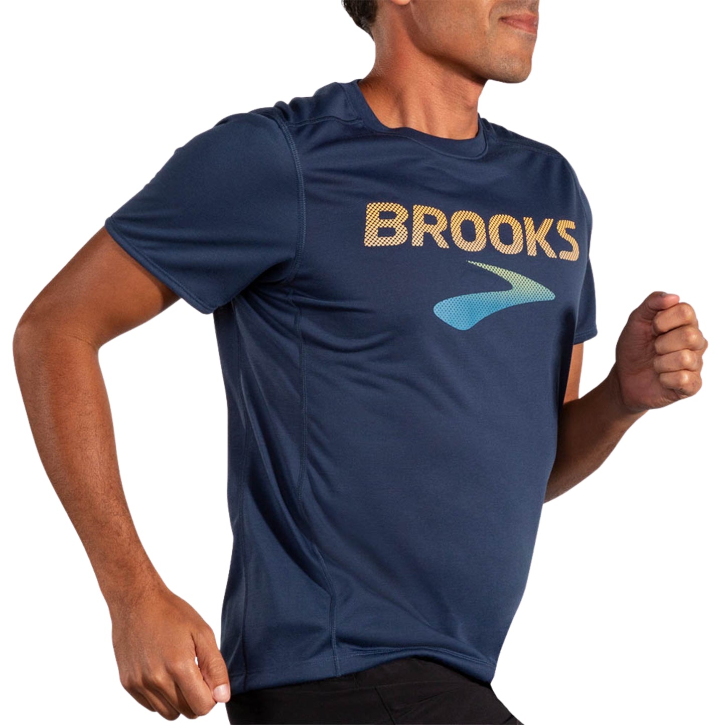 Man wearing a blue Brooks t-shirt on a white background