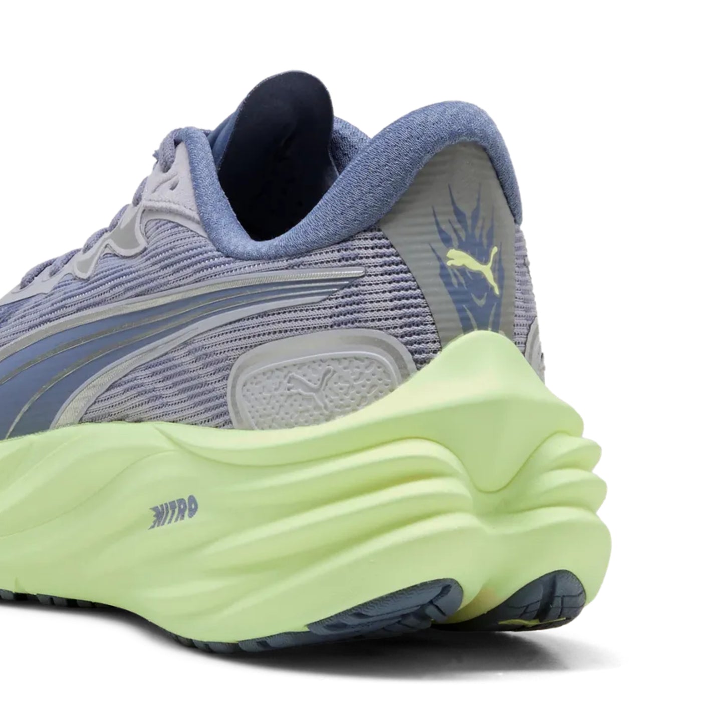 Puma running shoe with a light purple upper and bright green sole on a white background