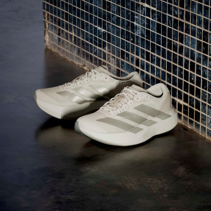 Beige Adidas running shoes
