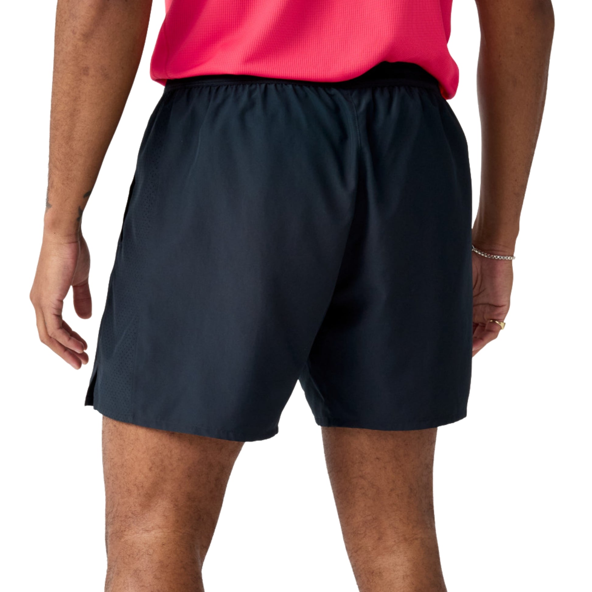 Man wearing black Brooks running shorts on a white background