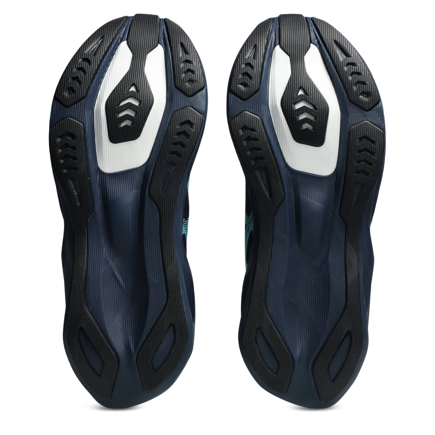 A pair of Asics running shoes shown from the sole view, featuring a dark navy blue and black textured rubber outsole with a prominent white accent panel on each side, set against a plain white background.