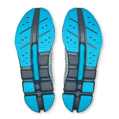 Blue and black shoe soles on a white background