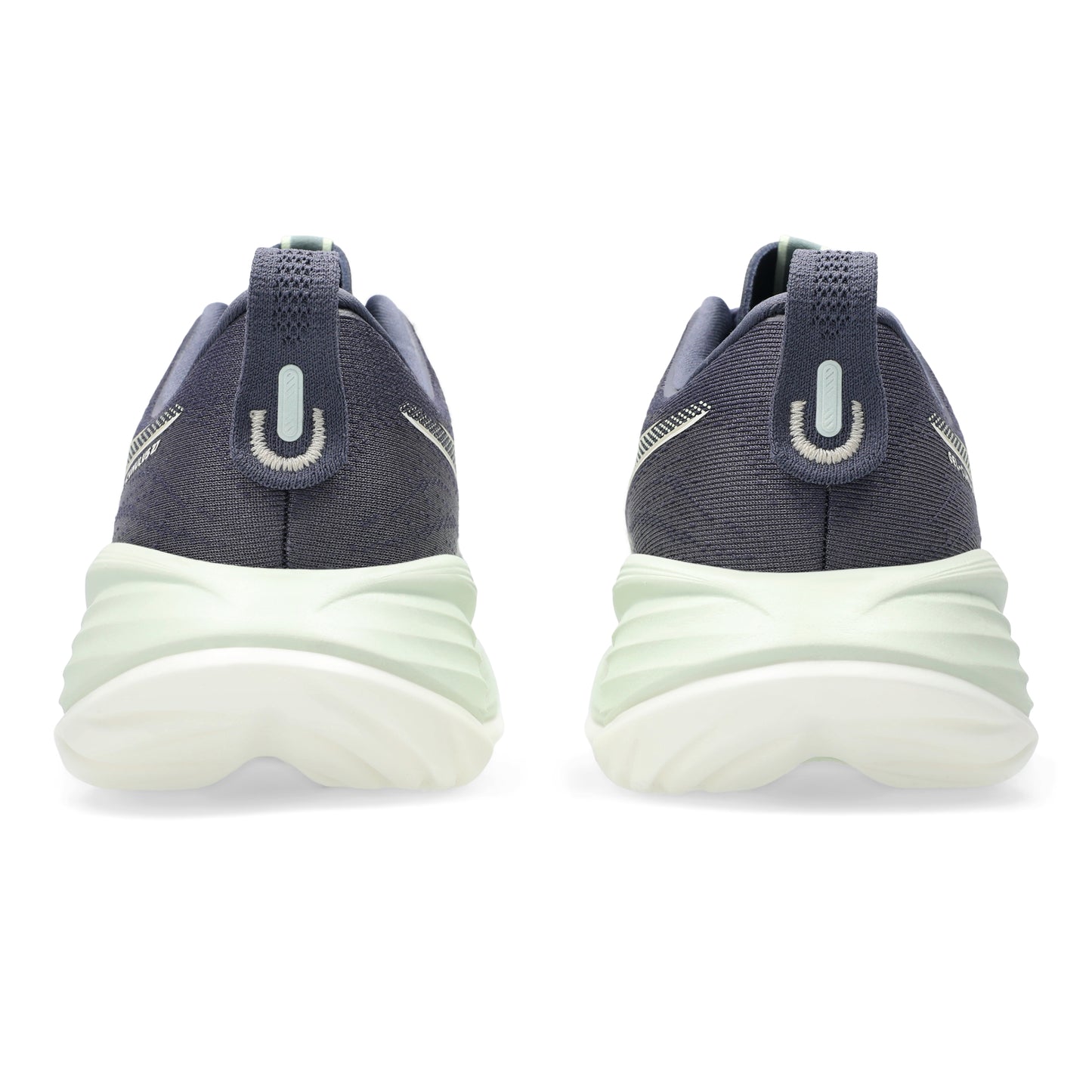 Pair of navy and white sneakers on a white background