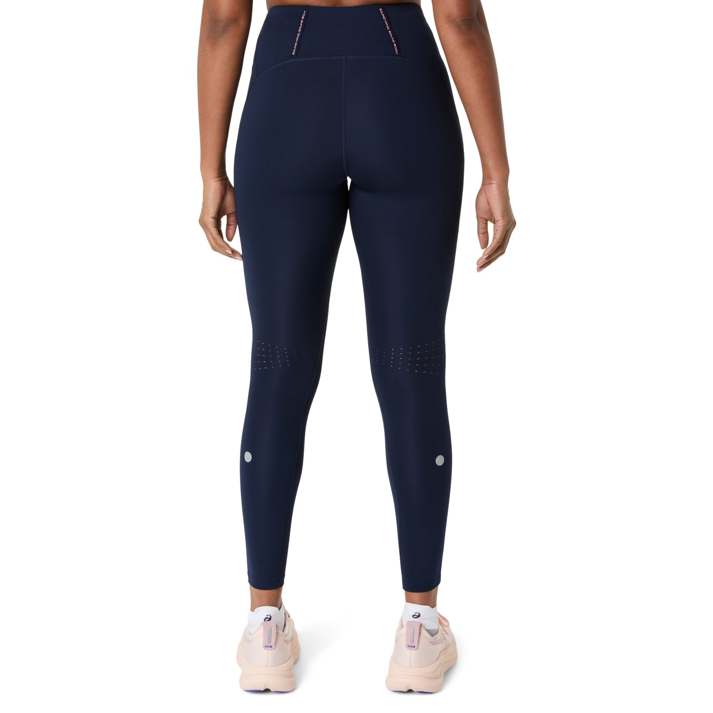 Asics Navy leggings worn by a person on a white background