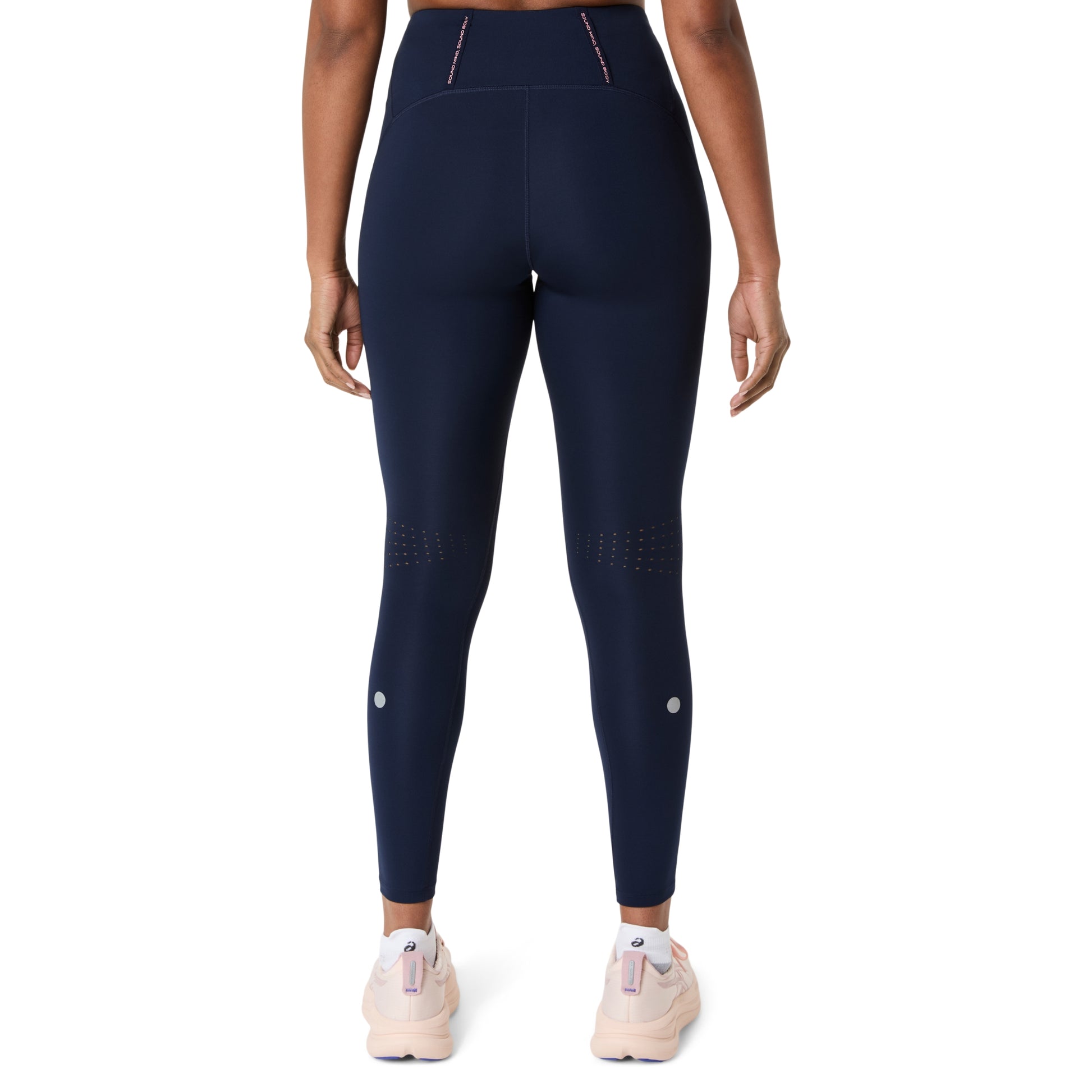 Asics Navy leggings worn by a person on a white background