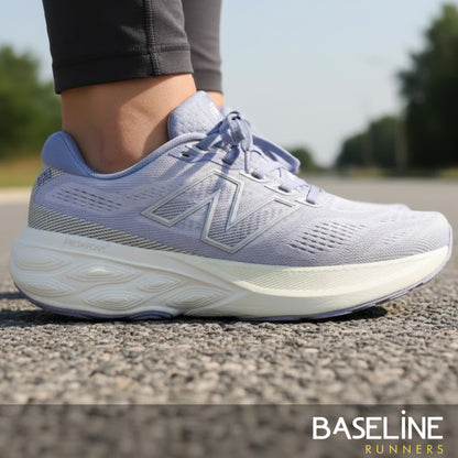 Light purple running shoe on a road with 'Baseline Runners' branding.