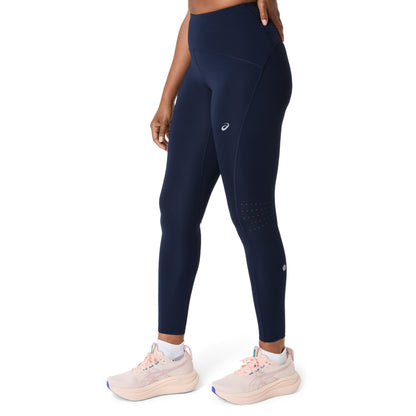 Person wearing navy Asics tights with a visible brand logo on a white background