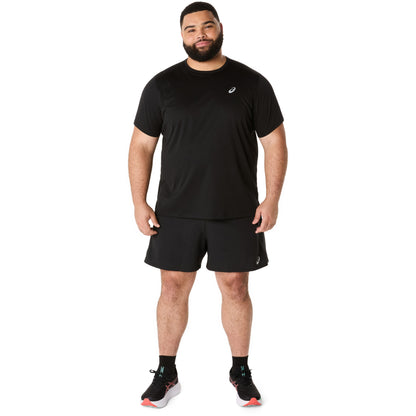 Man wearing a black athletic outfit with a logo on a white background