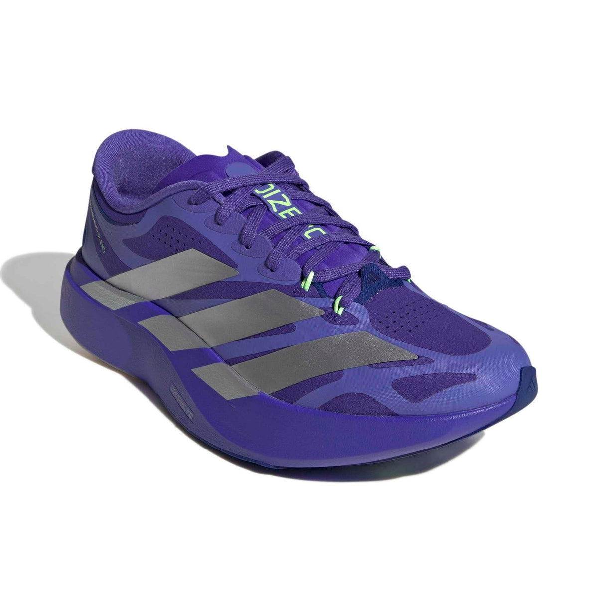 A single Adidas running shoe in blue with gray three-stripes and small neon green accents, shown on a white background with a soft shadow.