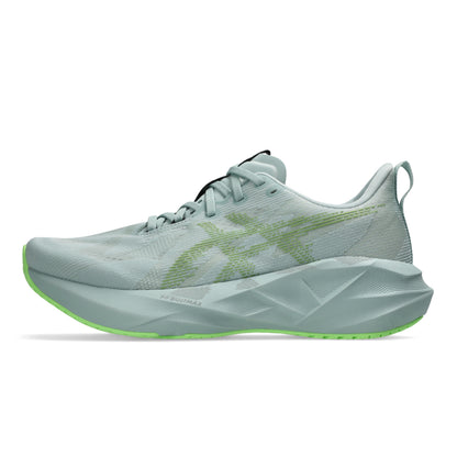 Light blue running Asics shoe with green sole on a white background