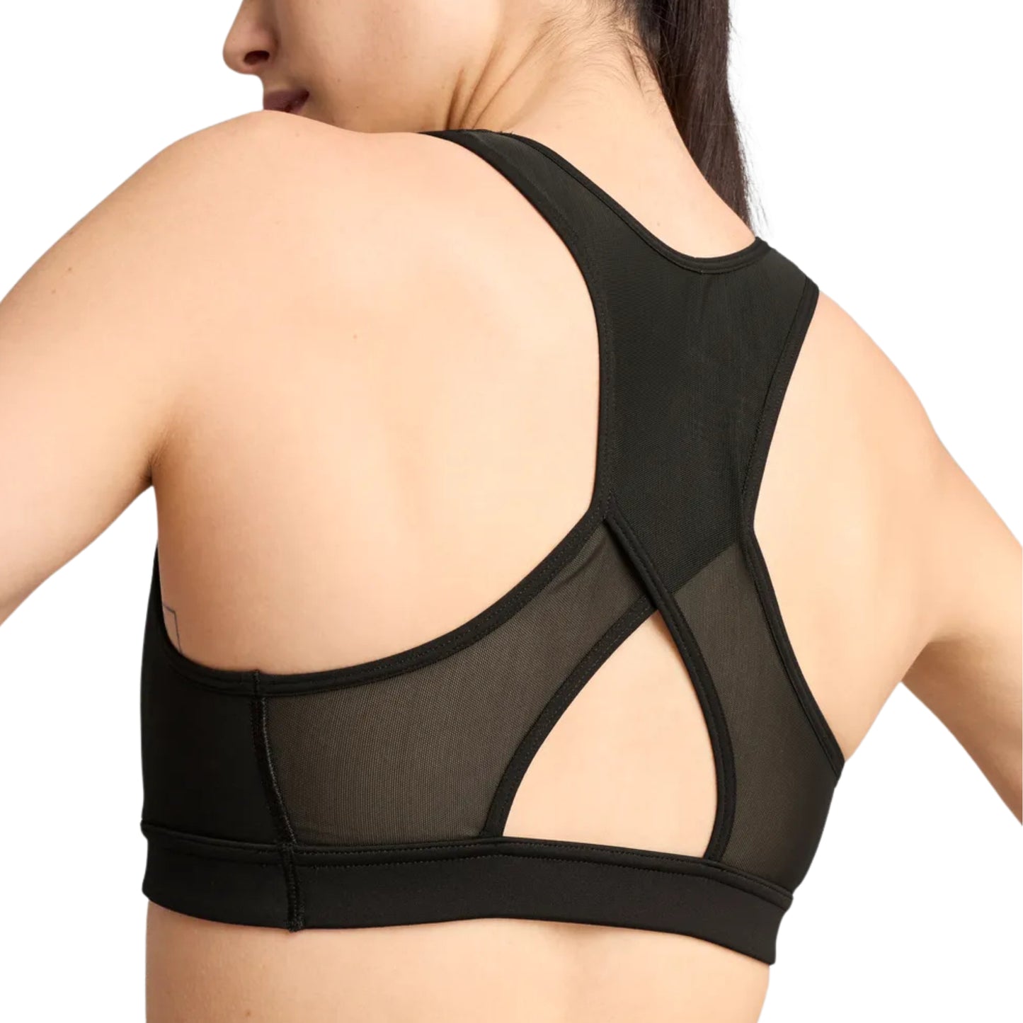 Black sports bra with mesh panels on a white background