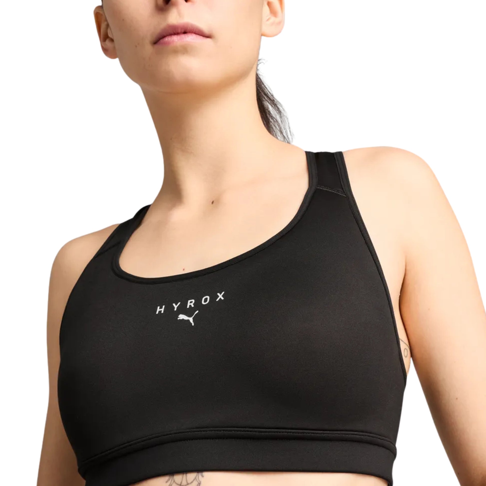 Black sports bra with 'Hyrox' logo worn by a person on a white background
