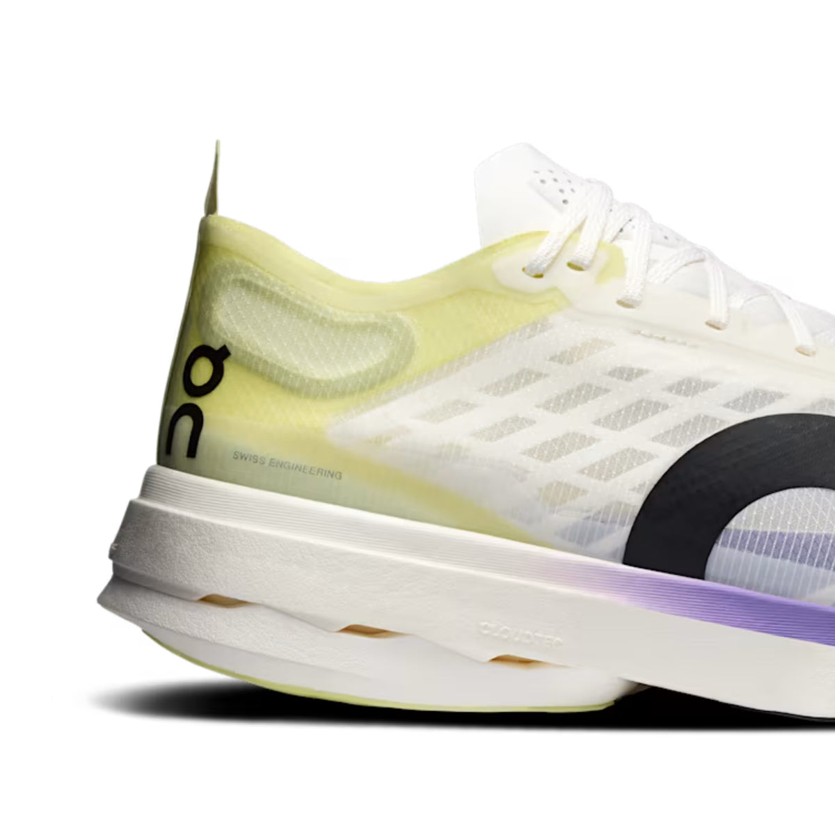A close-up side view of an On running shoe in white and pale yellow, featuring a black On logo on the heel and a purple accent near the sole, set against a plain white background.