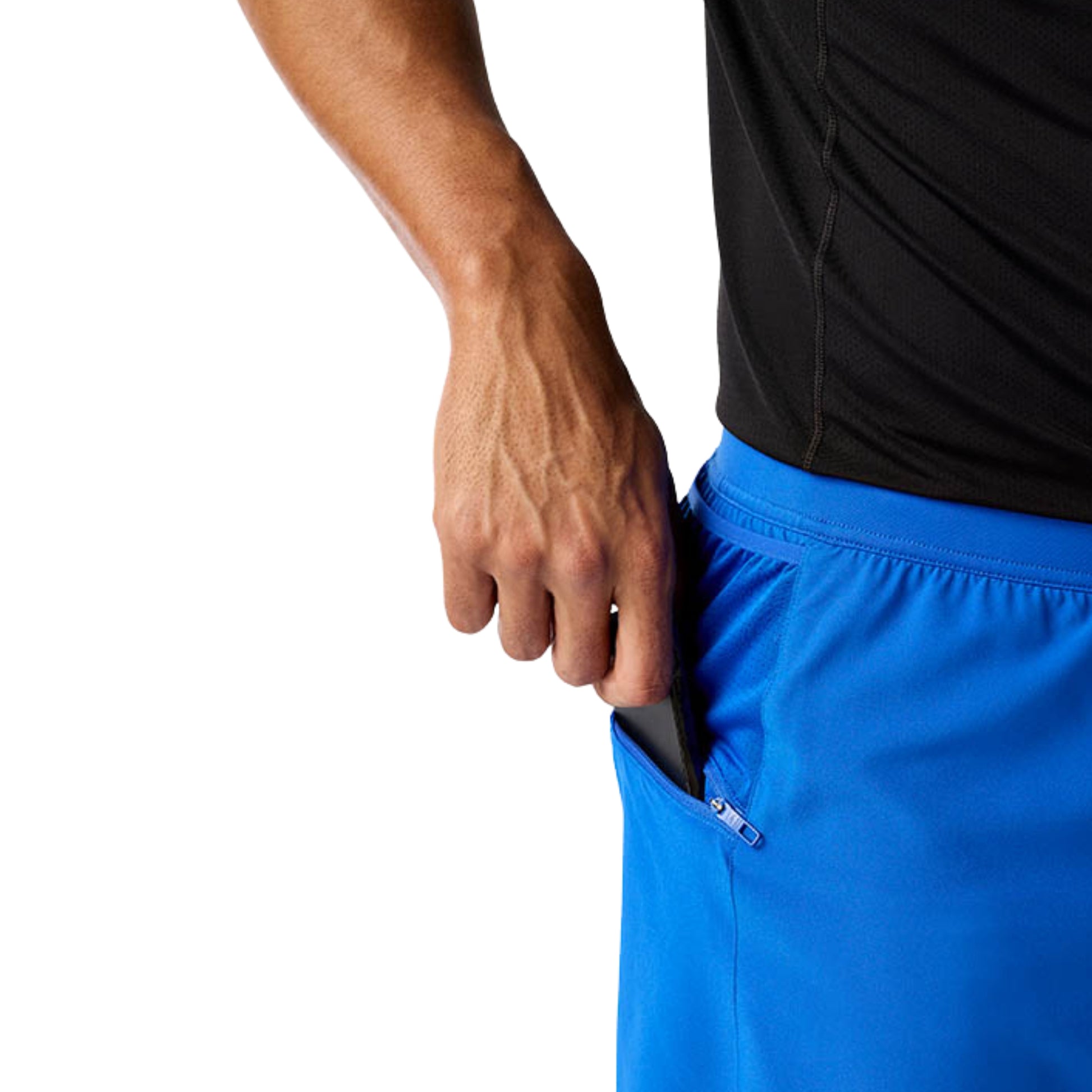 Person wearing blue running shorts with a black waistband on a white background