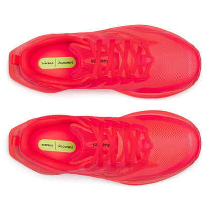 Pair of red Saucony running shoes on a white background